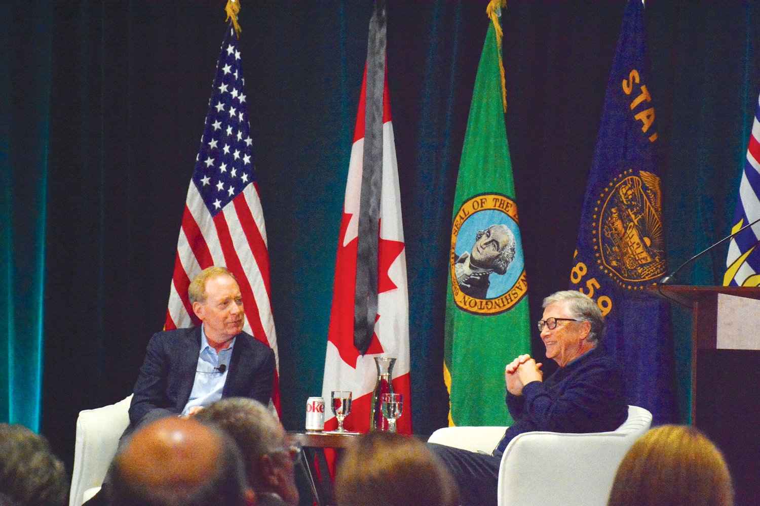 Brad Smith, Microsoft president and vice chair (l.), and Microsoft co-founder Bill Gates discuss climate action at the 2022 Cascadia Innovation Corridor’s “Cascadia 2050 vision: Moving to climate action” conference at Semiahmoo Resort on September 12.