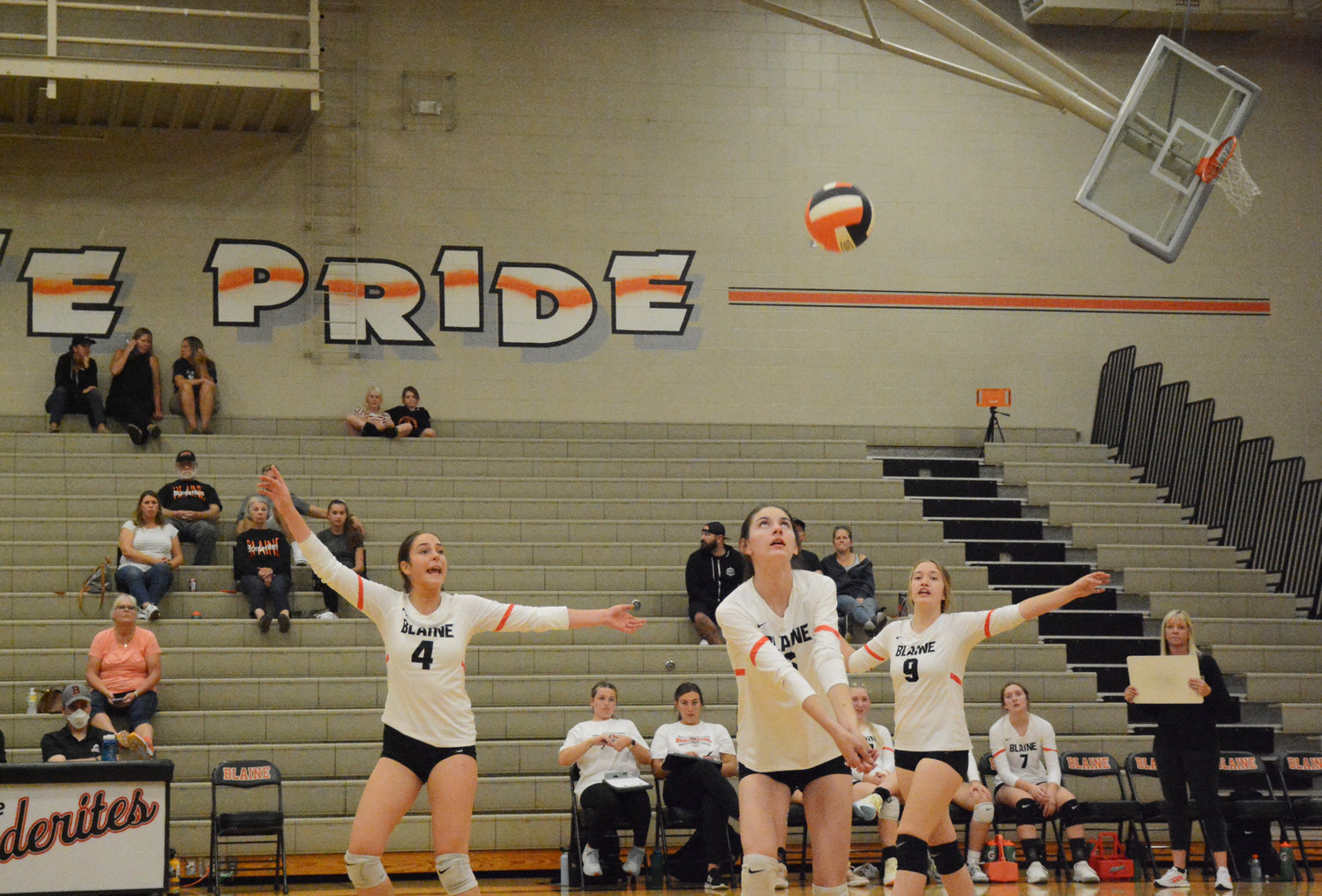 Kaitlyn Harrington looks to bump the ball over the net as teammates Gillian Rea and Brie Smith offer some encouragement. Blaine girls volleyball lost to Lynden in three straight sets September 20 in the Blaine High School gymnasium.