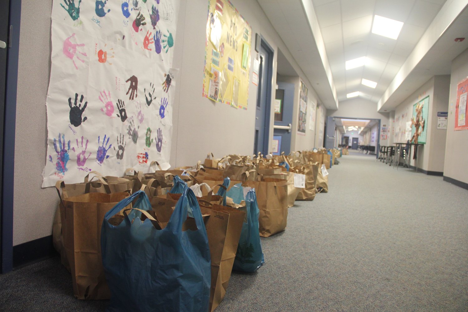 Food collected by Blaine school students stretched down the hall in Blaine Elementary School. Although the amount of food hadn’t been counted by November 21, school staff expects it to likely exceed the 11,000 pounds of food that were collected last year. Blaine elementary and primary students, above, partnered with Cost Cutter to collect food and monetary donations. From l. top row; Dylan Magnussen, Bryce Bradley, Eloise Olsen, Nolan Lewis, Mason Nowakowski, Teagan Wystrup. From l. bottom row; Maddy Hawkins and Toby Hawkins.