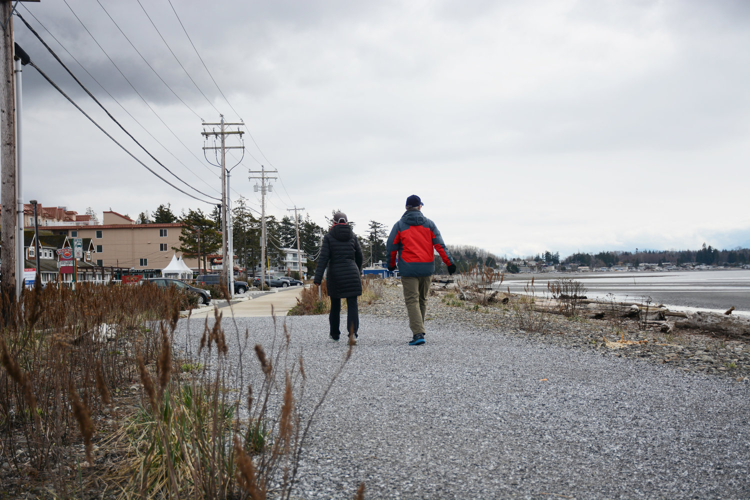 People walk along the Birch Bay berm on March 10.