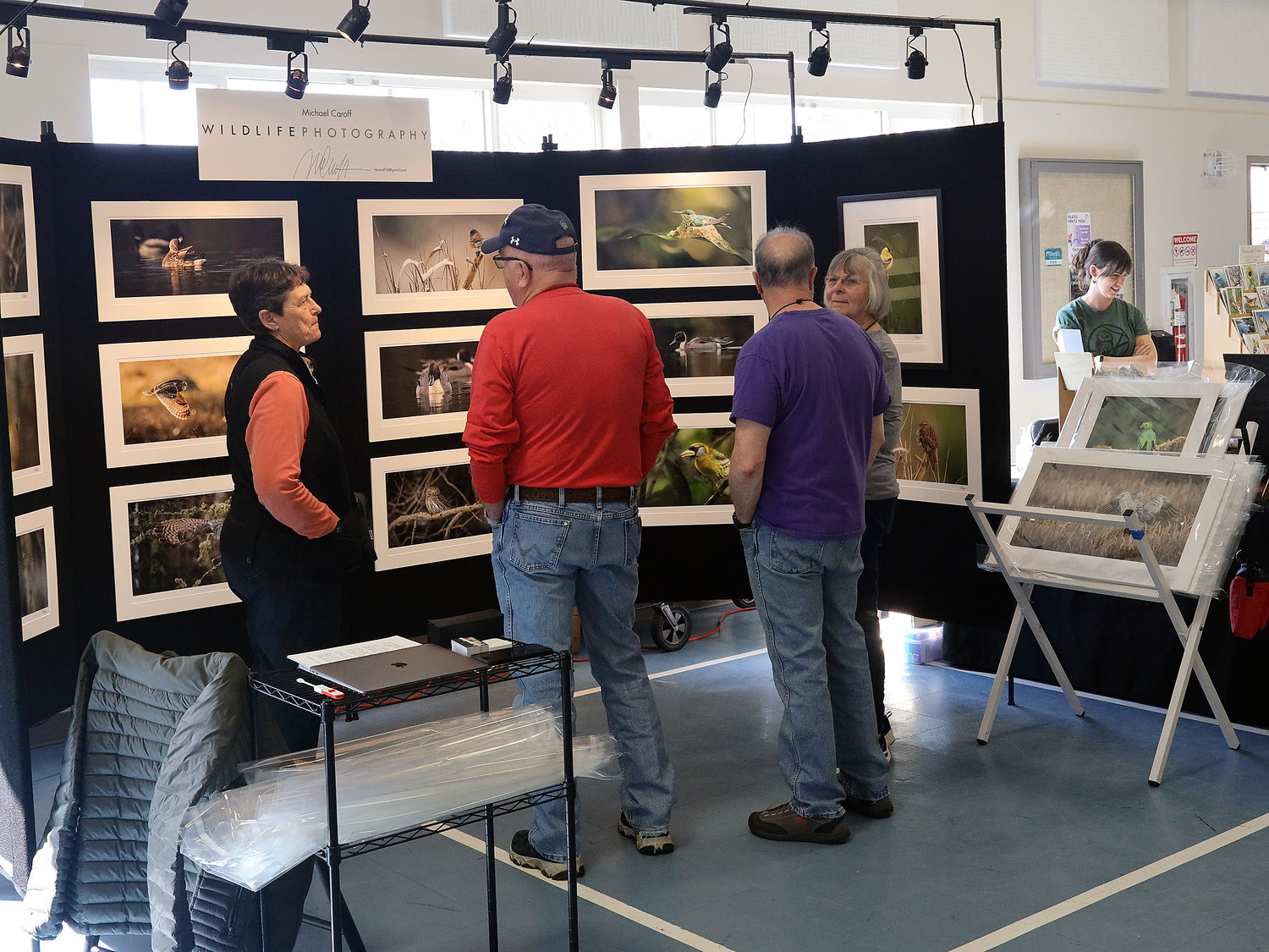 A vendor displays their wildlife photography at the expo.