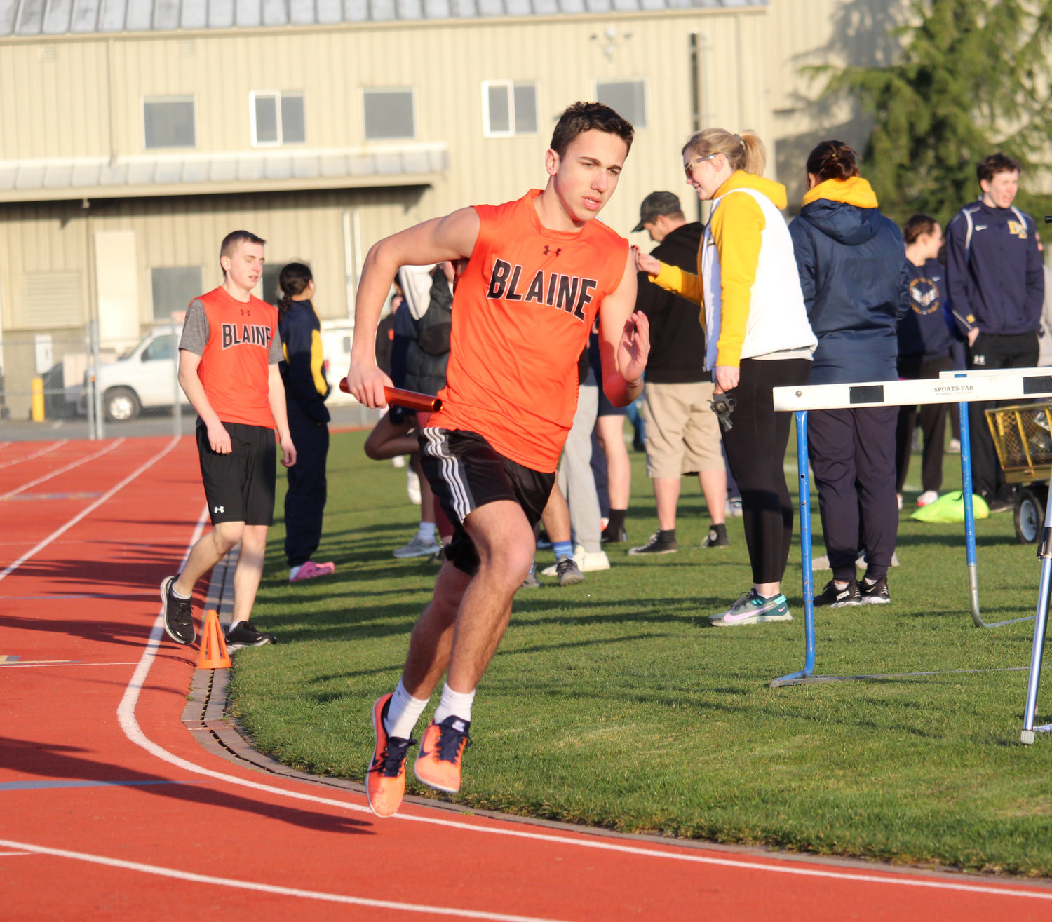 Dylan Johnson running the second leg of Blaine’s 4x400 meter relay at Burlington-Edison High School March 15.