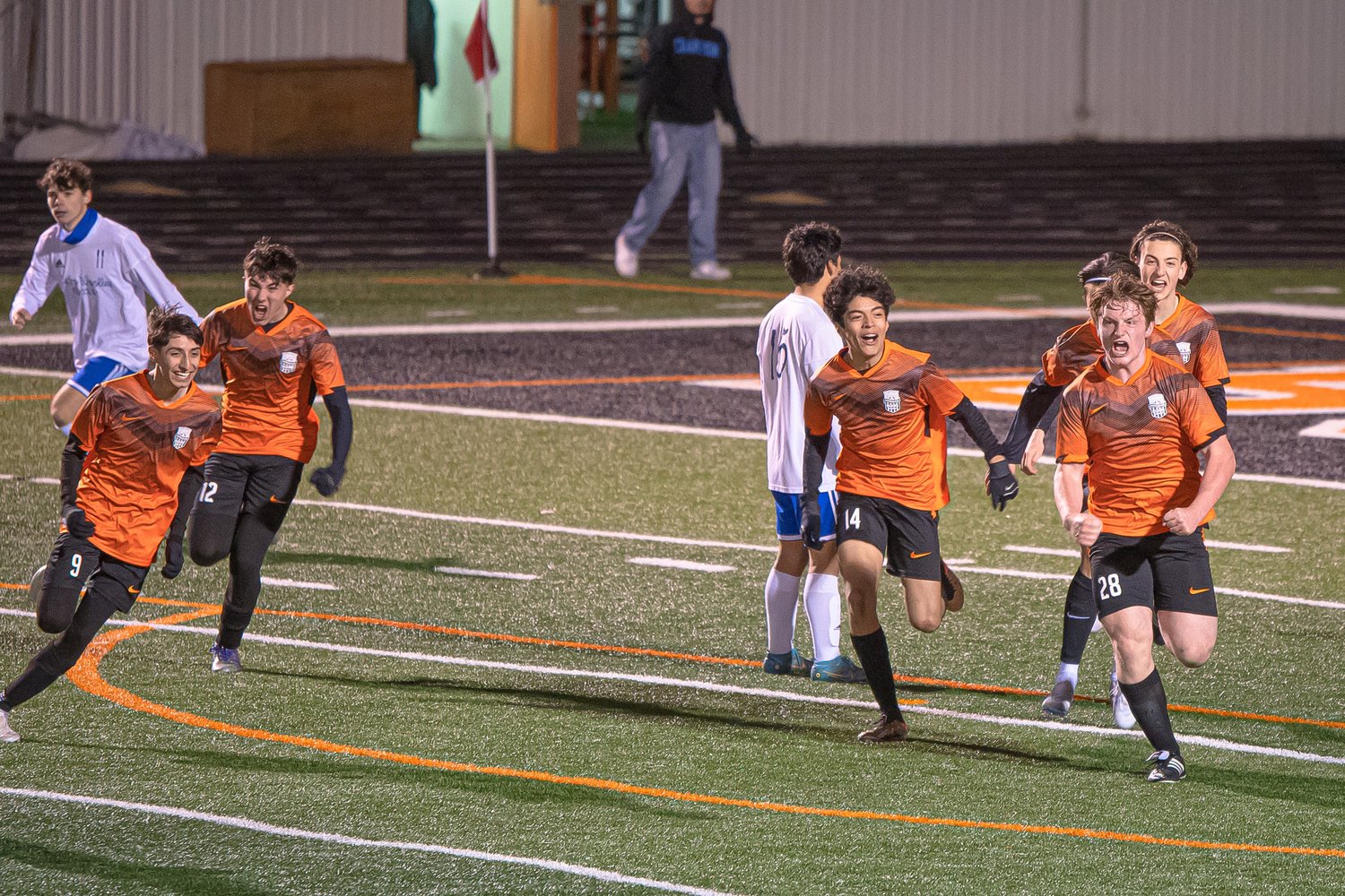 Blaine boys soccer players celebrate a late goal in the team’s 2-0 win over Sedro-Woolley High School March 24 at the Blaine High School stadium.