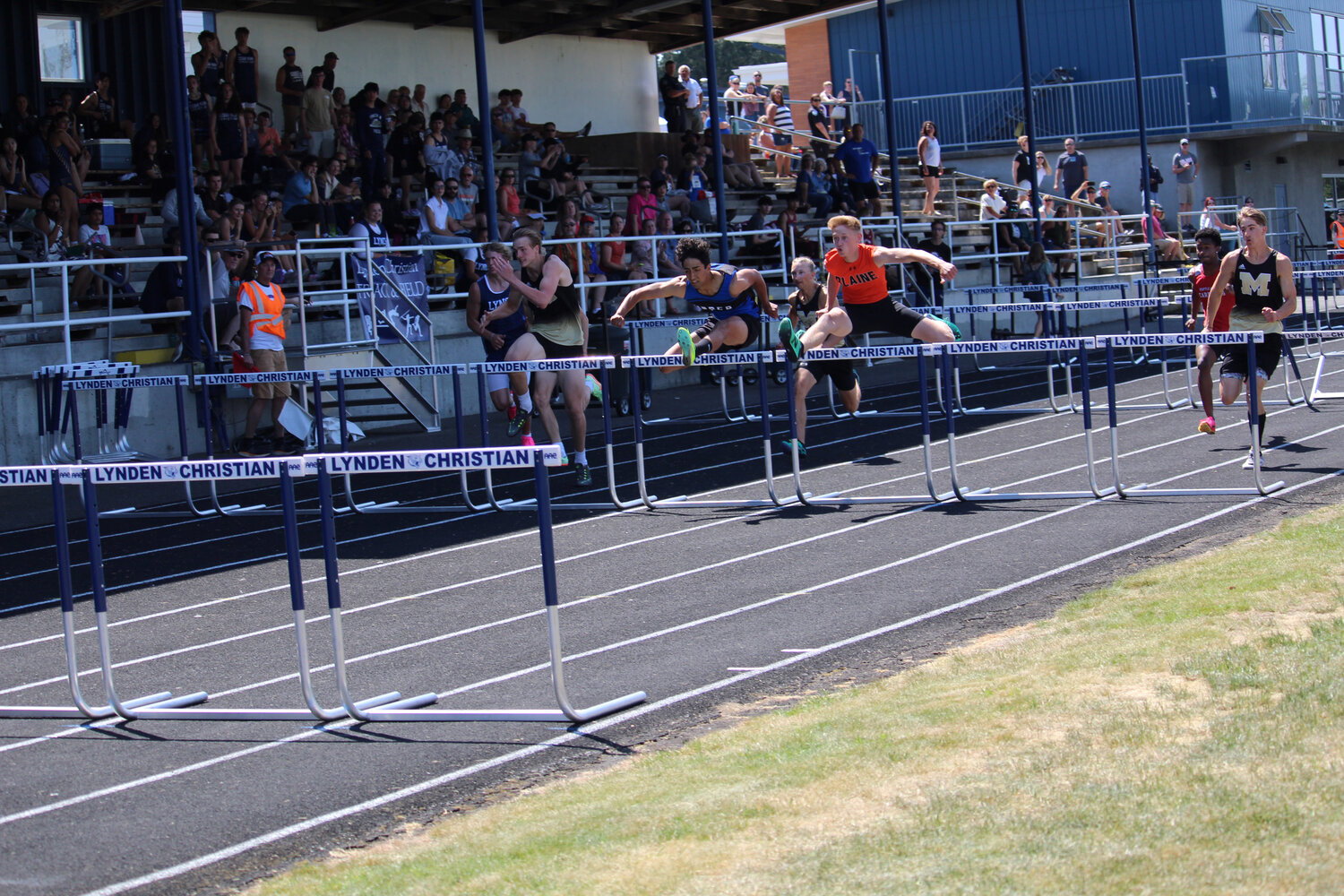 Josiah Weeda, r., in the 110-meter hurdles final at Lynden Christian High School May 20.