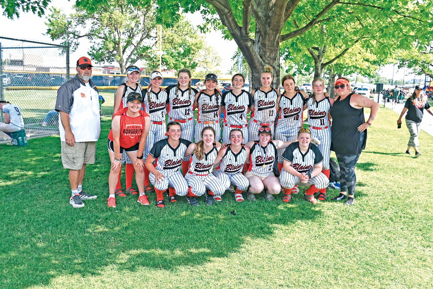 Blaine’s varsity girls softball team at the 1A state championship in Richland on May 27. The Lady Borderites lost 10-0 to eventual state champions Montesano in the semifinal. This was the first time softball went to state since 2009. Coaches Sean Miller, l., and Riley Miller, r., stand beside their team.