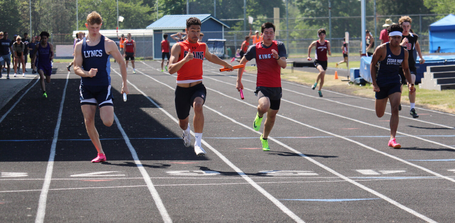 AJ Bennett, second from left, finishing the anchor leg in Blaine’s 4x100 relay at the bi-district championships at Lynden Christian High School May 20.