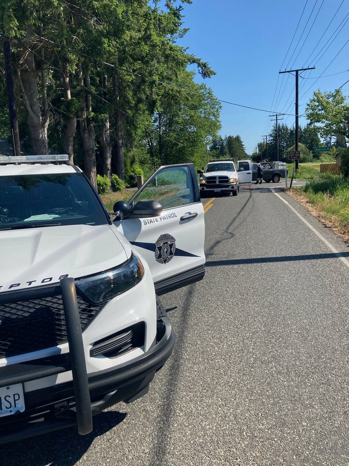 Washington State Patrol troopers block the intersection of Blaine and Anderson roads while responding to a vehicle accident on June 6.