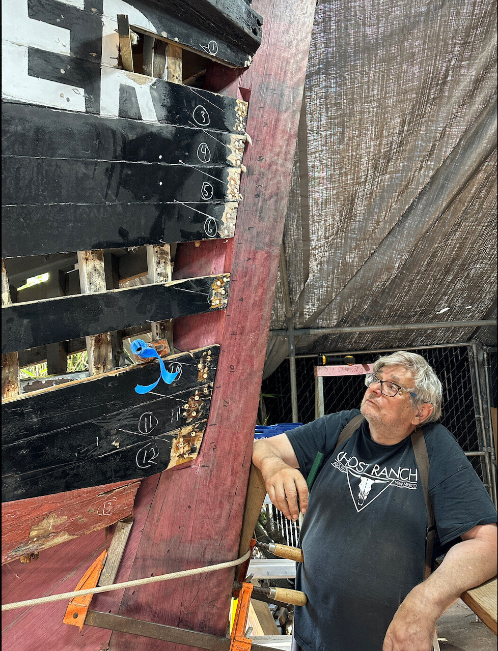 Shipwright Steve Alaniz checks progress on the Plover ferry.