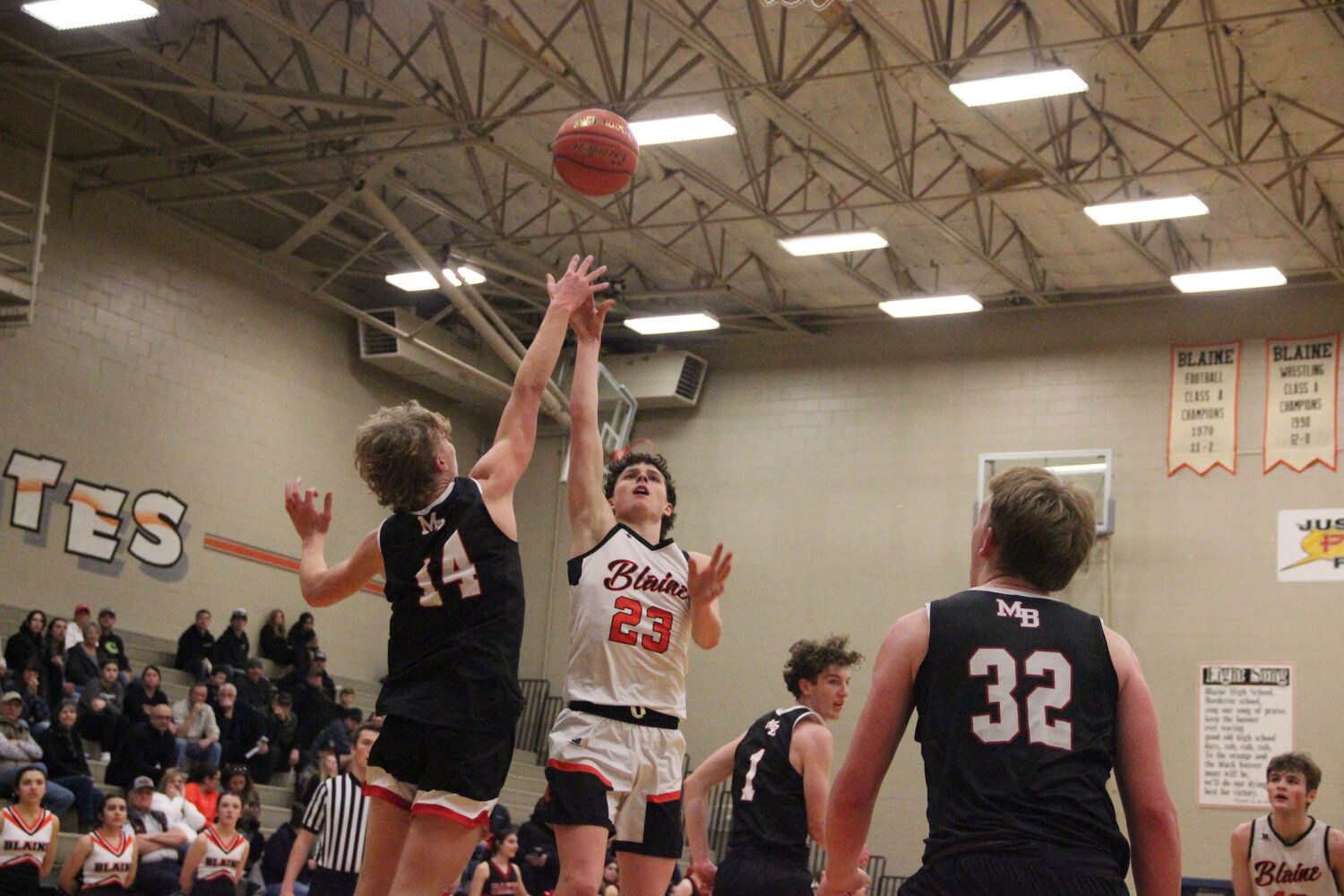 Blaine senior guard Jesse Deming attempts a floater against a pair of Mount Baker defenders. Deming had eight points on the night, all of which came in the third quarter when the Borderites were desperately mounting a comeback attempt.