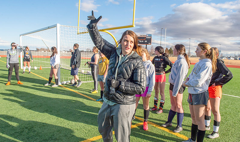 Powell High School girls soccer Coach Kaitlin Loeffen works with her squad during a March 12 practice, shortly before all practices &mdash; and all spring sports &mdash; were called off due to the COVID-19 pandemic. It was a tough first year for the coach and for her players, who lost their season.