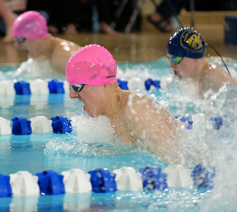 PHS senior Nate Johnston rises out of the water during the finals of the 100 breaststroke in Douglas Saturday. Johnston broke both the meter records for the 3A North Conference 200 IM and 100 breaststroke on both Friday and Saturday and earned Athlete of the Meet honors.