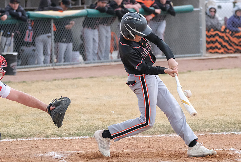Ethan Welch drives a pitch in a contest against Lovell in Cowley Thursday. The percussion caused at the point of contact shows the high force present when bat meets ball. The Pioneers defeated the Mustangs in a 4-0 shutout. Powell travels Sunday to take on Laurel in a doubleheader at 1 and 3 p.m.