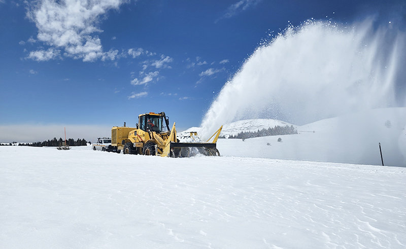 Lovell heavy equipment operator Rick Gurney operates a snow blower on top of the Bighorn Mountains during the annual opening work of U.S. Highway 14A east of Lovell in early May.