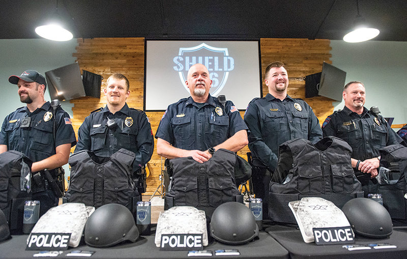Powell Police Department Chief Roy Eckerdt, flanked on the left by Sgt. Dustin DelBiaggio and officer Trevor Carpenter, and on the right by officer Matt Koritnik and Lt. Matt McCaslin, pose with their custom-fit body armor and accessories during a ceremony at New Life Church. The event celebrated community donations that helped Shield 616 provide the equipment to the entire force free of charge. Shield 616 is a Colorado-based non-profit organization that helps properly equip police forces.