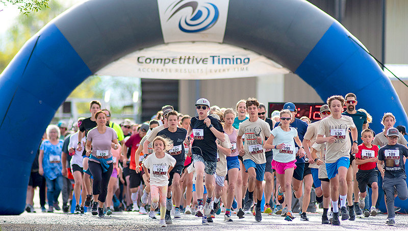 Runners hit the streets of Powell Saturday morning after starting at the Park County Fairgrounds for the Dano&rsquo;lope Dash, a charity event to raise money for Dano Youth Camps. This year runners and obstacle course participants broke a record for attendance with 265 registered.