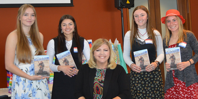 The 2022 Park County Republican Women scholarship recipients pose with keynote speaker Ashlee Lundvall (center). From the left the recipients are: Allison Edwards of Cody, Delaney Salzman of Meeteetse, Madison Harvey of Powell and Kabrie Cannon of Powell.
