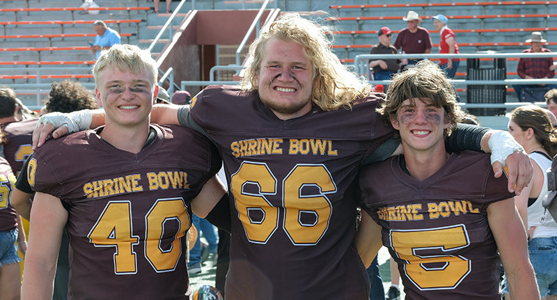 Toran Graham, Lane Shramek and Zach Ratcliff came together for a photo following their victory in the Shrine Bowl on Saturday.
