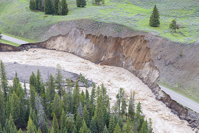 A section of the Northeast Entrance Road (U.S. Highway 212) in Yellowstone National Park washed into the Lamar River Monday, one of several sections lost in the park and in gateway communities serving the park. The North and Northeast entrances are &lsquo;likely&rsquo; closed for the season, said superintendent Cam Sholly.
