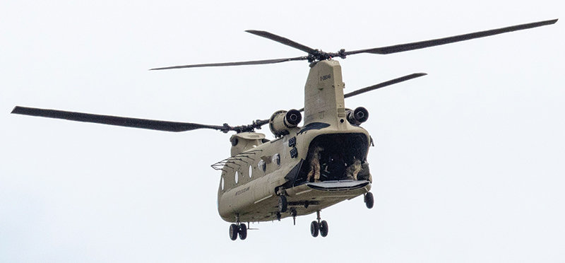 A Montana National Guard helicopter is used to transport stranded visitors out of the Gardiner area Tuesday. The Red Lodge airport is being used as a staging area for the operation.