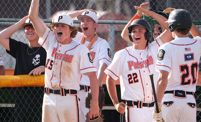Continuing to celebrate by tapping their heads, the Pioneer dugout brought the energy on Friday after an Aidan Wantulok triple. From left: Devin Kokkeler, Brock Johnson, Jacob Gibson, Aiden Greenwald, Jhett Schwahn and Trey Stenerson.