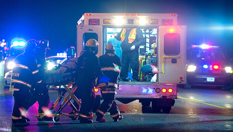 Emergency responders wheel an accident victim into an ambulance on Coulter Avenue in Powell in December. Medical transport services in the Big Horn Basin struggle to find enough staff and volunteers, and funding for training is limited. With ambulances costing up to $1 million to operate annually, it&rsquo;s hard to cover costs for the small population of the Big Horn Basin, which is spread out over miles of gas-guzzling highways.