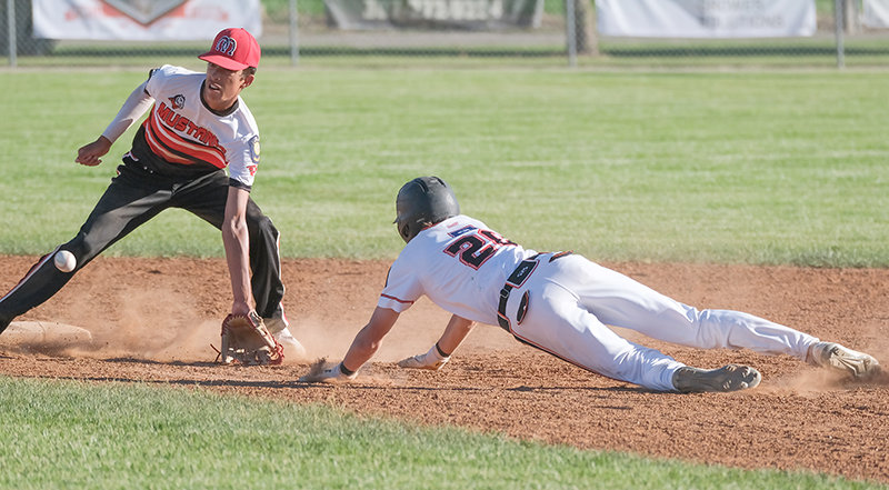 Trey Stenerson puts all his effort into a dive, attempting to beat the tag. The Pioneers swept Lovell in a doubleheader on Wednesday, moving into second place in the A Northwest standings.