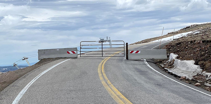 The Beartooth Highway is closed near the border between Wyoming and Montana. Visitors may head to the top of the pass, but are forced to turn around at the parking lot for the summer ski area. The highway should be open late this month.