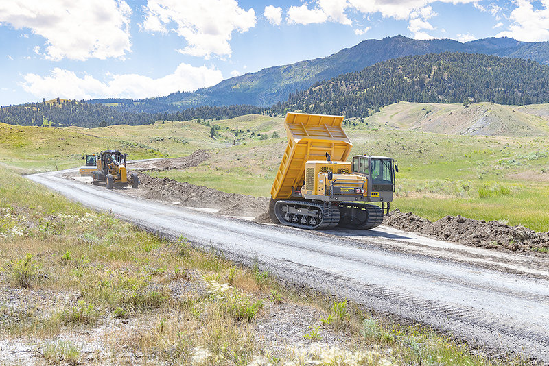 Crews work on the Northeast Entrance Road in the Lamar Valley of Yellowstone National Park. The road could be open as soon as mid-October, depending on weather.