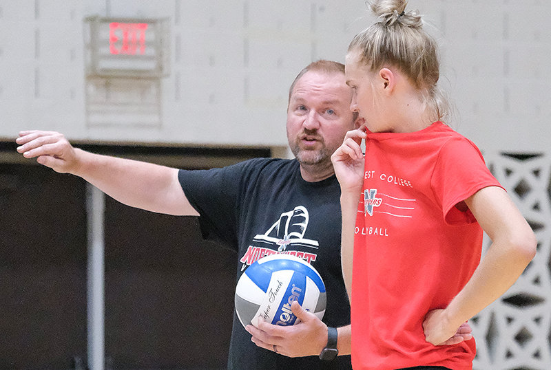Trapper volleyball coach Scott Keister talks with Sidney Parker about adjustments during practice early in the season. The Trappers open up their home schedule Thursday (tonight) at 7 p.m. against Wallace State Community College.