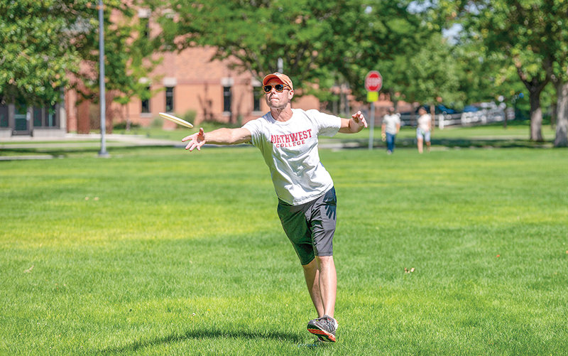 Northwest College associate professor Jay Dickerson sends his approach shot on the second hole at the Dee Havig Disc Golf Course, installed on campus in 2021. Dickerson won first place in the inaugural Kick-Off Week tournament, beating players from the school and avid players from around the community.