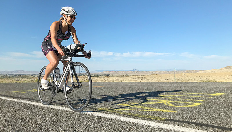 Rinda Eastman, of Powell, reaches the halfway point of the biking portion during the 2022 Western Sugar Beet Classic triathlon fundraiser held Aug. 20 for the Powell Swim Club. Eastman swam, biked and ran her way to a first place finish in her division.