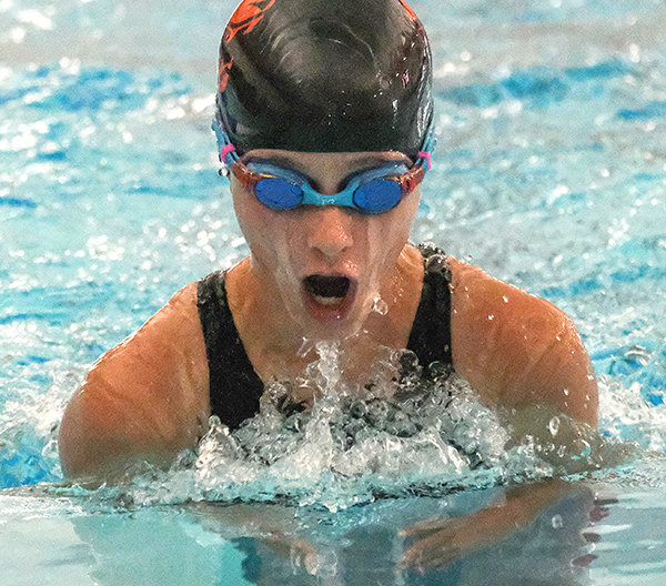 Emma Sapp rises out of the water during the 100 breast on Saturday at the Gene Dozah Invitational.