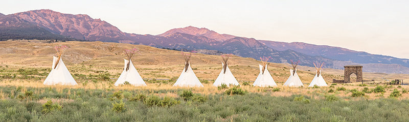 Tepees line the North Entrance Road in Yellowstone National Park near Roosevelt Arch. There is a movement to restore hunting rights to indigenous tribes, based on a treaty in 1868.