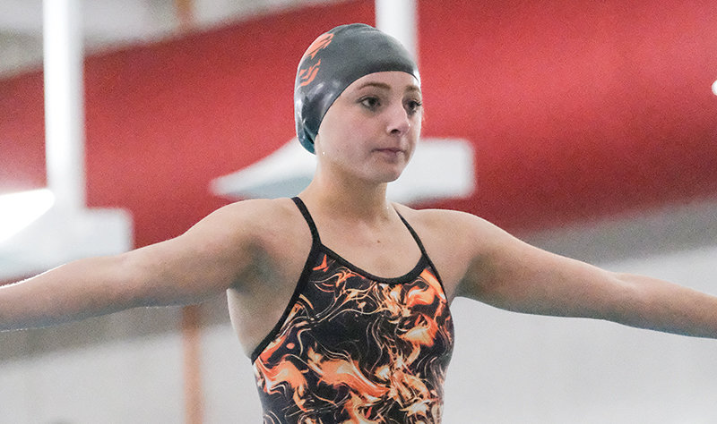 Aramonie Brinkerhoff collects herself before performing a dive during the Powell Triangular on Oct. 13. She recorded another state qualifying score during the meet.