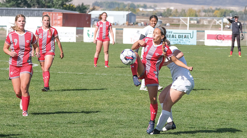 Quetzalli Penaloza volleys a ball while being pressured by a Western Wyoming defender in the Trappers&rsquo; final home game on Oct. 14. Northwest fell in the Region IX quarterfinals on Friday 2-0.