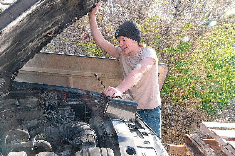 Powell High School student Dane Lauritzen stares excitedly at the V8 in an Eddie Bauer Edition. He plans to tear out the engine and put it into a Ford Ranger that will be painted in Eddie Bauer colors.