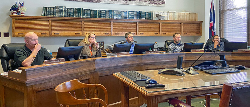 Park County commissioners Scott Mangold (from left), Dossie Overfield, Lee Livingston, Lloyd Thiel and Joe Tilden listen to a Zoom presentation by land use plan consultant Darcie White with Clarion.