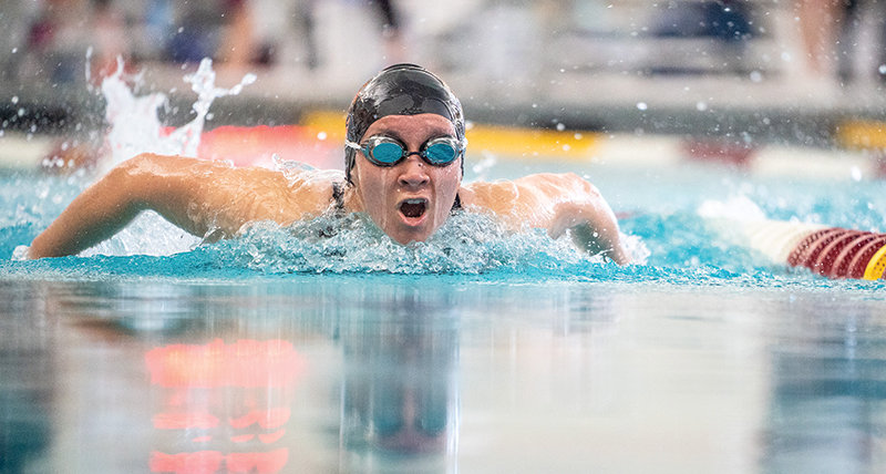 PHS junior Kik Hayano rises out of the water during the 100 fly at the Swim and Dive State Championships in Laramie on Friday.