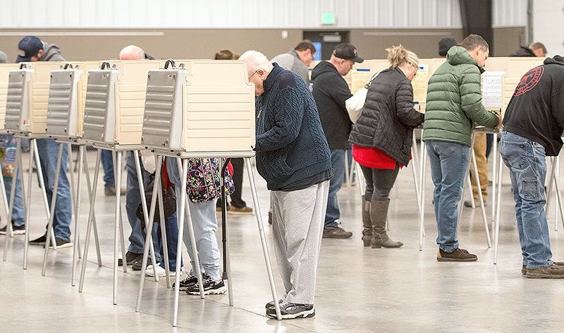 Early voters fill the voting booths Tuesday at Heart Mountain Hall in the Park County Fairgrounds. Election day voting was steady, but not as high as the Aug. 16 primary.