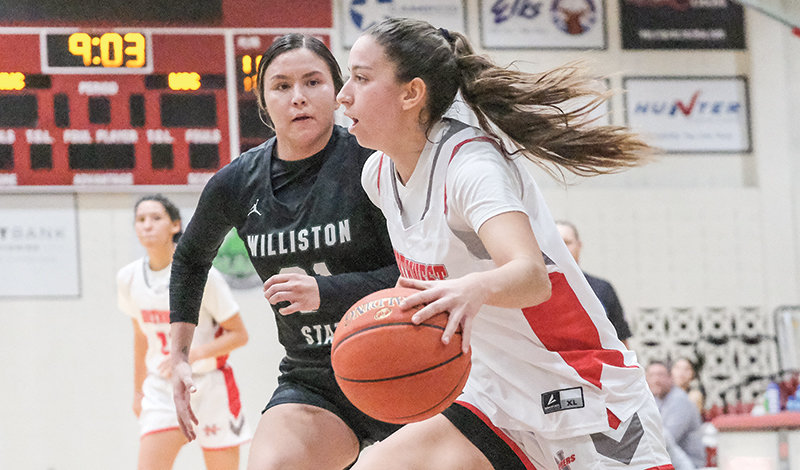 Jimena Montoro-Cabezas drives past her defender on the baseline Monday. The Trappers have started their season strong going 5-1.