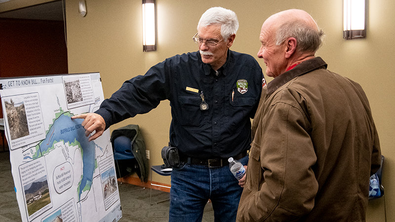 Buffalo Bill State Park Superintendent Dan Marty discusses ideas for the next generation in the park with Evan Bennett while meeting in the Grizzly Room on Monday night at the Park County Library.