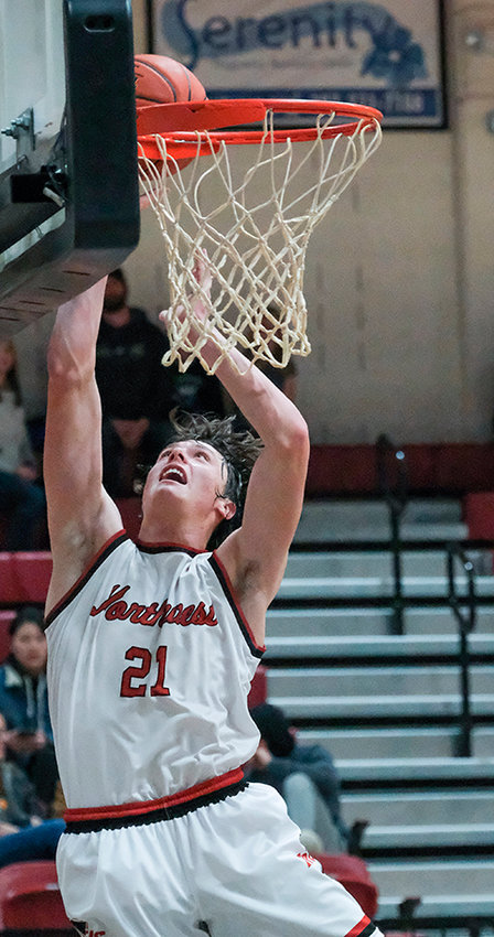 Kolter Merritt finishes at the rim during the Trappers&rsquo; victory over the All-Stars on Friday. Merritt was named the first recipient of the Jay Collins Memorial Scholarship during halftime of the game on Friday.