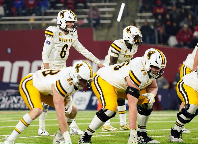 Wyoming quarterback Andrew Peasley shouts instructions during the Cowboys&rsquo; matchup against Fresno State on Friday.