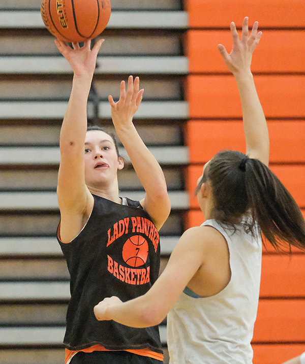 Saige Kidd shoots a jump shot over the outstretched hand of fellow sophomore teammate Catelynn Floy during a scrimmage on Thursday.