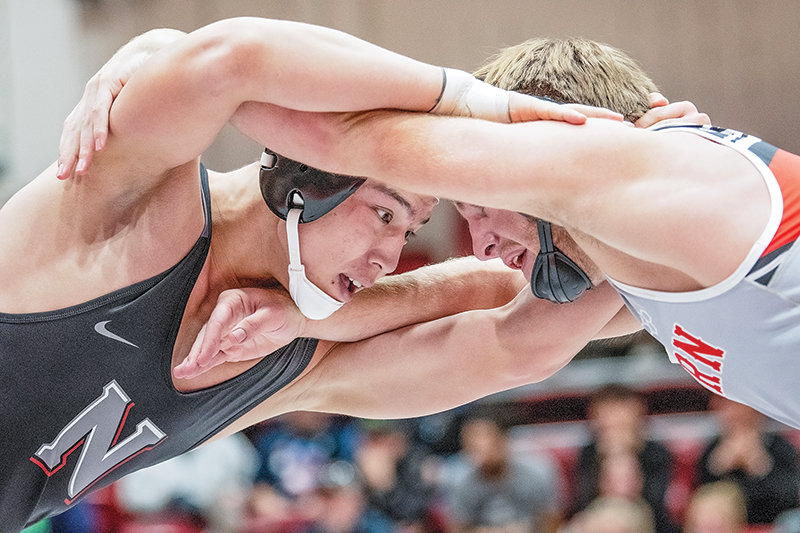 Aziz Fayzullaev (left) battles with Western Wyoming&rsquo;s Christian Smoot during the Joe Mickelson Memorial Wrestling Open in November. Fayzullaev defeated Smoot in a No. 1 vs No. 2 matchup on Friday in a dual in Rock Springs.