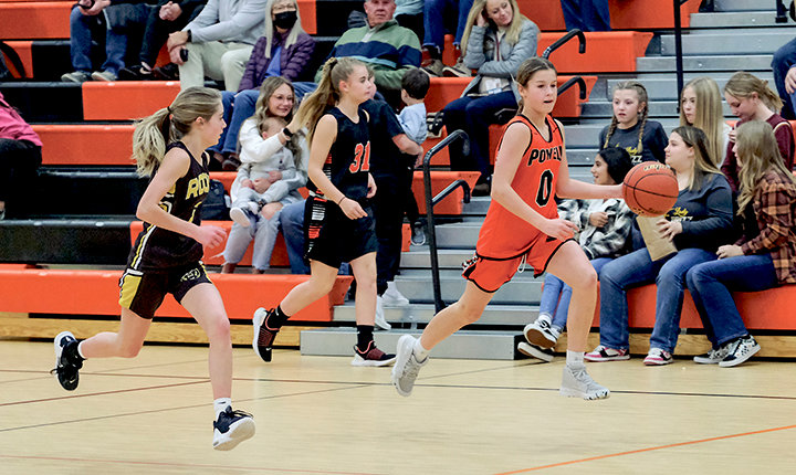 Kaedenze Carter pushes the ball up the court for the eighth grade girls during a matchup against Rocky Mountain on Nov. 17.