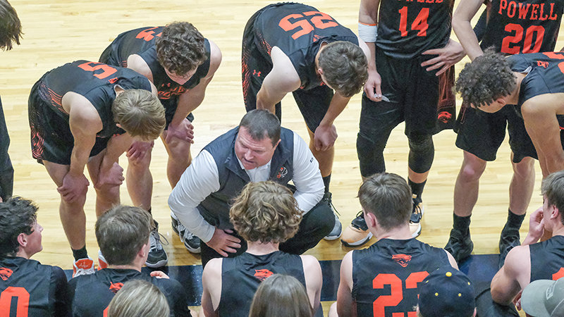 Coach Mike Heny talks to his team during a timeout in the fourth quarter of the Panthers&rsquo; come-from-behind victory over Cody on Dec. 16.