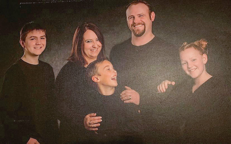 Brock Ninker and his family of four pose in an old family photo. From left: Thomas Ninker, Sasha Ninker, Drake Heintz, Brock Ninker and Robin Ninker.