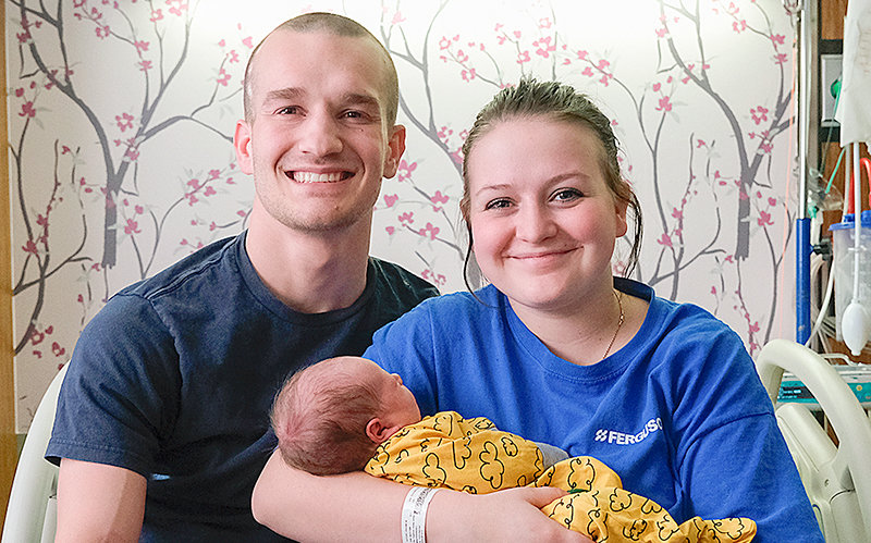 Nathan Gifford (left) and Shianne Gifford sit with their newborn son Osbern Gifford, who was born Jan. 1 at 1:18 a.m. making him Powell&rsquo;s first baby of the new year.