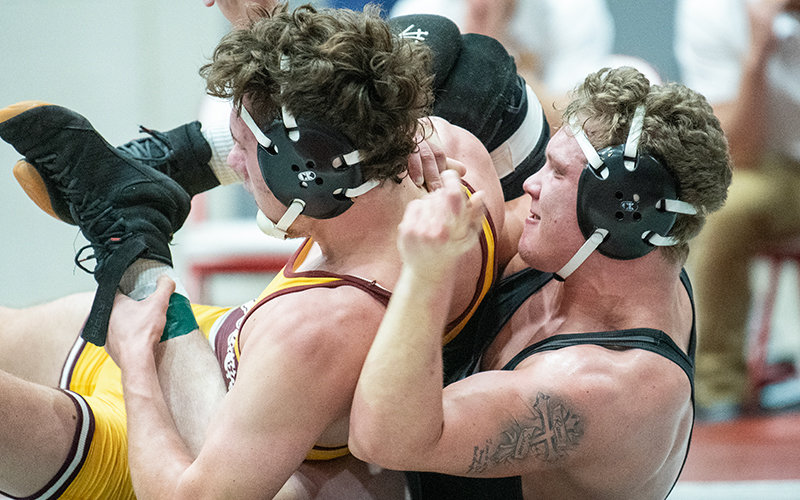 Cody Todd (right) battles during the Joe Mickelson Memorial Wrestling Open in November in Powell. The Trappers will return to Cabre Gym for the first time since the open on Tuesday to battle MSU-Northern.